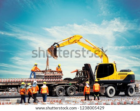 construction worker working on construction site to unloading material on conconstruction site Royalty-Free Stock Photo #1238005429
