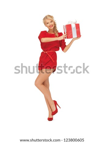 bright picture of woman in red dress with present