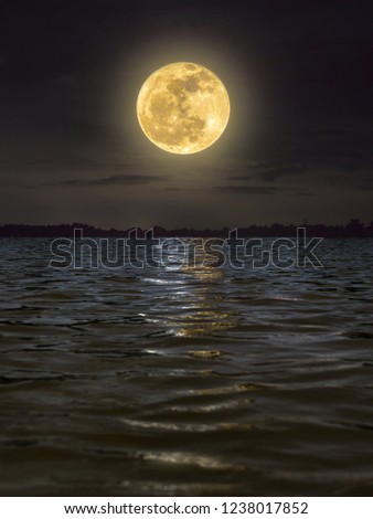 fullmoon reflected over the river