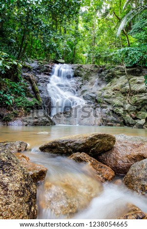 beautiful deep forest waterfall in Thailand