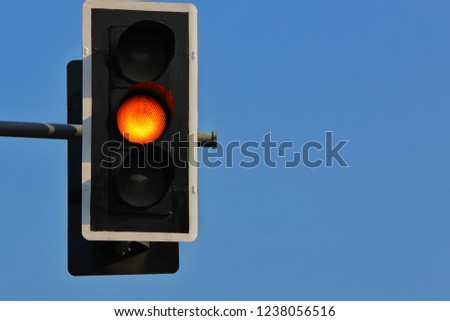 Traffic light against the sky