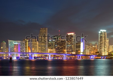  Miami Florida  downtown illuminated business and luxury residential buildings, hotels and Biscayne Bay bridge.Night Cityscape of World famous travel location.