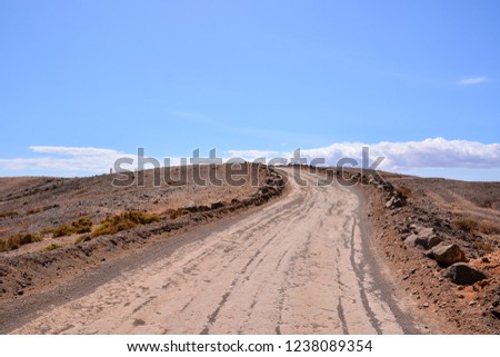 Photo Picture of a Dirt road leading off into the desert
