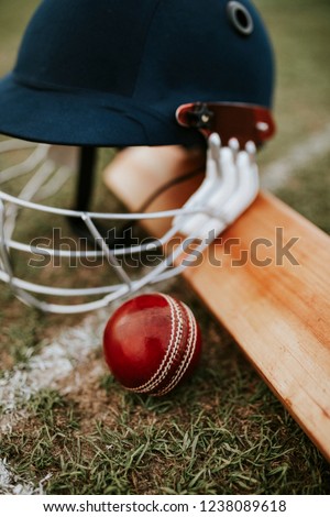 Cricket equipments on green grass