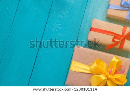 Festive blue background. Turquoise background for Christmas cards. Blue wooden boards. Sprig of fir on a wooden Board.