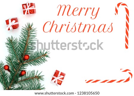 Christmas holiday's composition. Christmas gifts, fir tree and sweet candy canes on white background. Flat lay, top view, copy space.