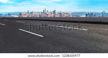 Road Ground and Urban Skyline


