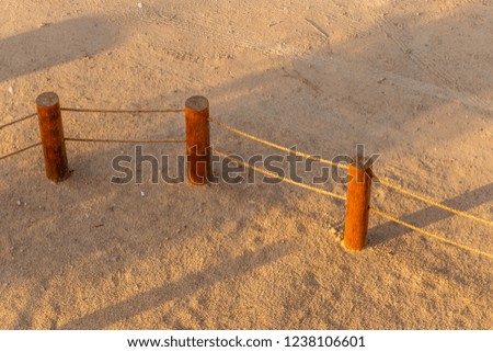 Wooden fence with rope