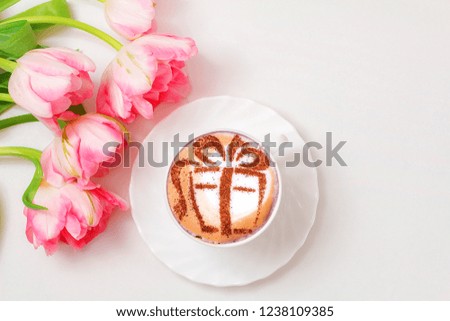 COFFEE Cappuccino with a picture of a gift on milk foam