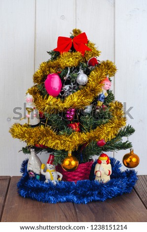 Small christmas tree with vintage old toys. Studio Photo