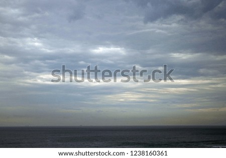 LIGHT ON CLOUD LAYERS OVER THE SEA