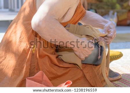 Monks are cleaning Wash dishes for food.