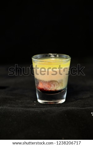 Alien Brain Hemorrhage shot cocktail with schnapps, blue curacao, baileys irish cream and grenadine