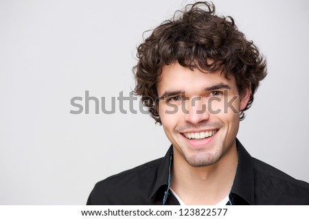 Close up portrait of a handsome guy with a smile on his face Royalty-Free Stock Photo #123822577