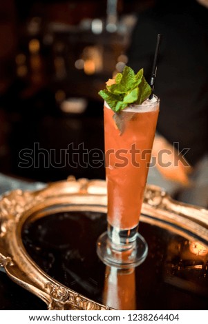 Ready alcoholic cocktail on the background of spice bars in a luxury bar, club, night club, restaurant, pub, evening, weekend