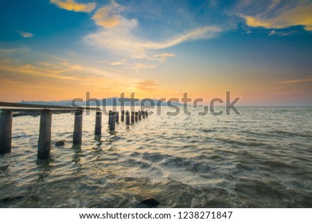 The abandoned jetty. Picture taken during sunset with selective focus.