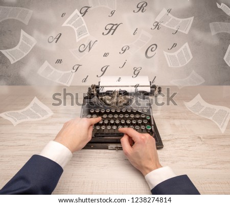 First person perspective hand typewriting with flying documents around