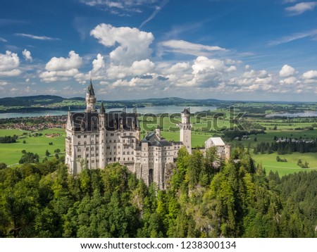 The great view of the Neuschwanstein Castle captured from the bridge. Germany. Royalty-Free Stock Photo #1238300134