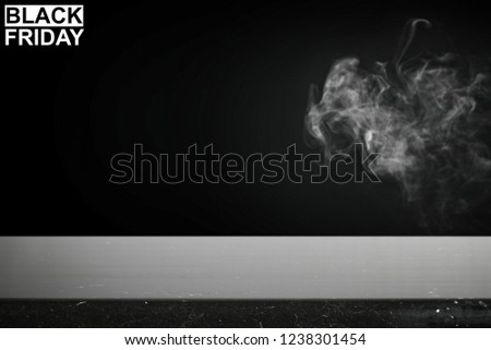 Table background of free space for your decoration and black friday time . Smoke decoration. 