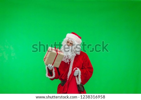 Picture of Santa Claus getting present out of his bag. chromakey