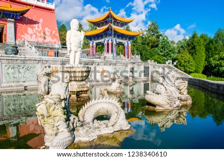 The baby Buddha in Dragon pool in Chongsheng Temple near Dali Old Town, Yunnan province, China. Ancient pagodas are popular tourist destination of Asia.
