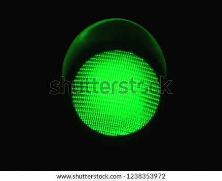 LED Green Light Traffic Light Isolated by a Black Background