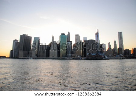 Skyline of Manhattan at sunset, closed to night. Nice view since Brooklyn