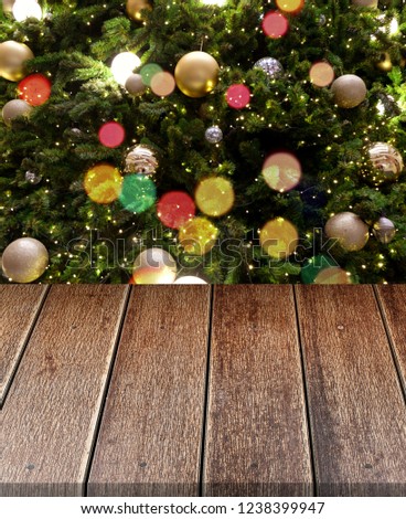 Empty old wooden table in front of Christmas or happy new year time background. christmas tree with colorful balls holiday background. Product display montage