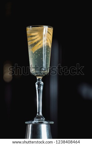 French 75 Alcoholic Cocktail garnish with a long ribbon of lemon peel