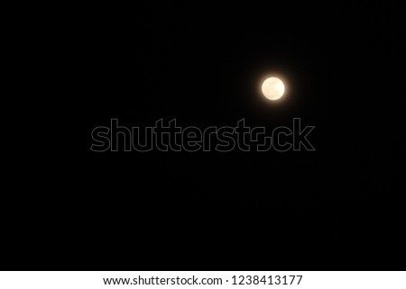 Moon on black sky background.