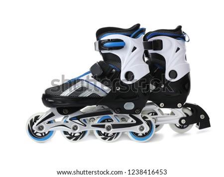 Pair of inline roller skates on white background