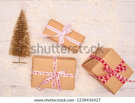 Christmas gift box. Christmas presents in paper boxes at white blue. Flat lay with copy space.