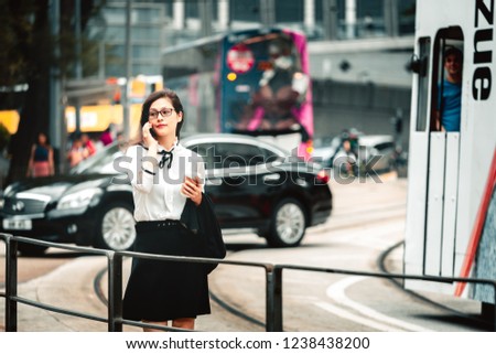 Business woman  walking on the city street.