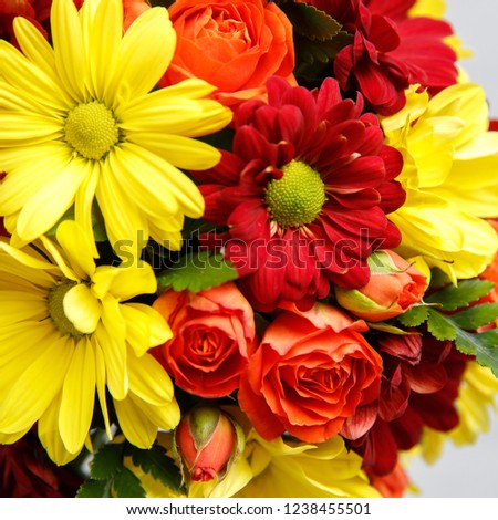 Mix bouquet of daisies, lilies, roses and exotic plants.