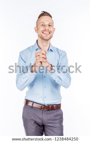 Young man on a white studio background. emotions and people concept.