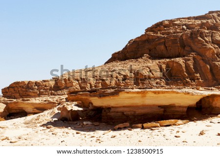 Stone rocks in the hot desert on a sunny day