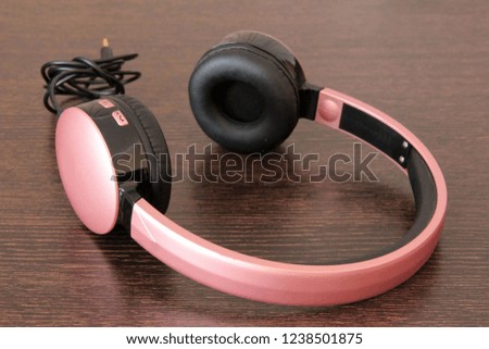 black and pink headphones