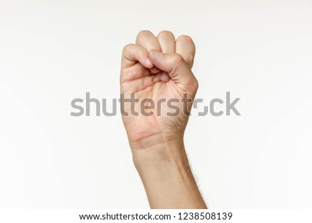 Hand on a white background spelling letters in american sign language