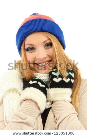 Young beautiful woman wearing winter clothing, isolated on white