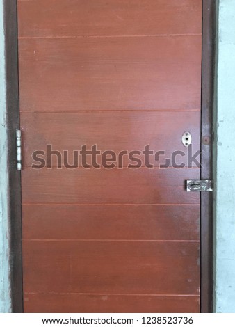The vintage wood door with old door lock