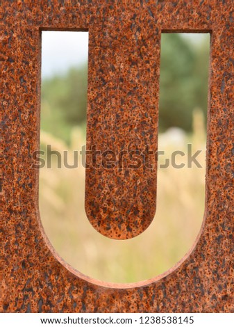 The letter U from old rusty metal
