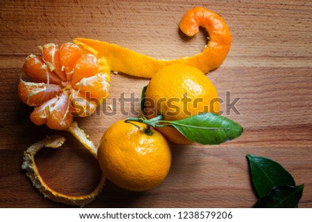Beautiful ripe juicy tangerines on a wooden board