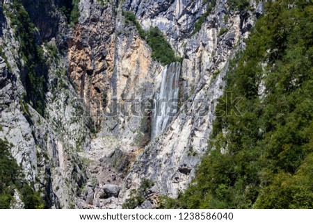 Famous slovenian waterfall Boka in Julian Alps in Triglav National park. Boka waterfall in karst alpine landscape. Nature waterfall, one of the highest in Slovenia. Slap Boka.
