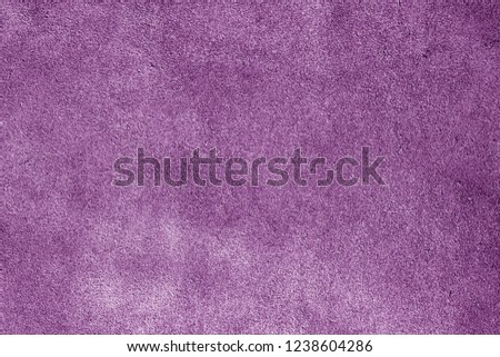 Natural leather surface in purple tone. Abstract background and texture for design.
