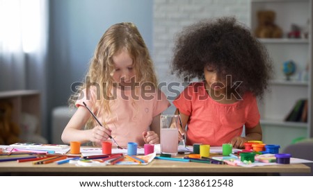 Two best fiends painting in kindergarten, preschool education, creativity