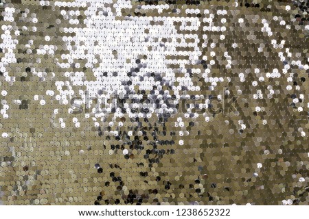 Fabric texture with silver sequins. Glitter background.