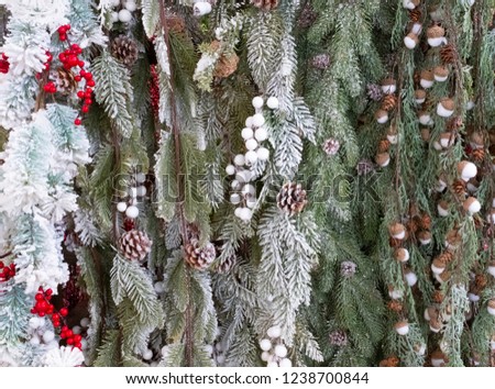 Christmas background with pine cones, acorns, twigs and snow