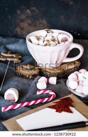 Good New Year spirit. Coffee with marshmallows and cinnamon. Pink mug. Cooking yourself.Home comfort. New Year. Christmas time. Winter mood.Letter to Santa Claus. To Do list.New Year resolution