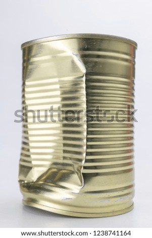 Can with meat dish on a white table. Canned food with a long shelf life. Light background.