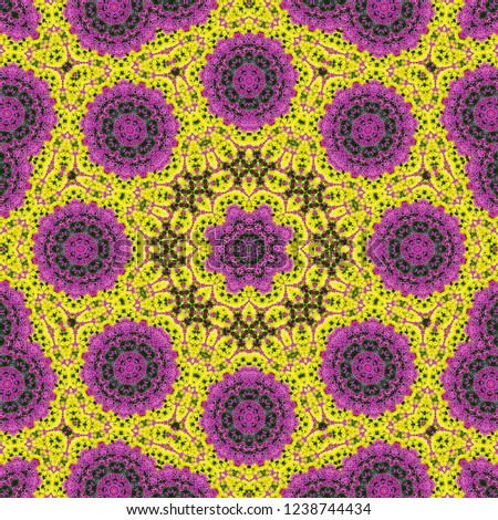 Pattern of beautiful purple, red and yellow flowers on the flowerbed. Kaleidoscope